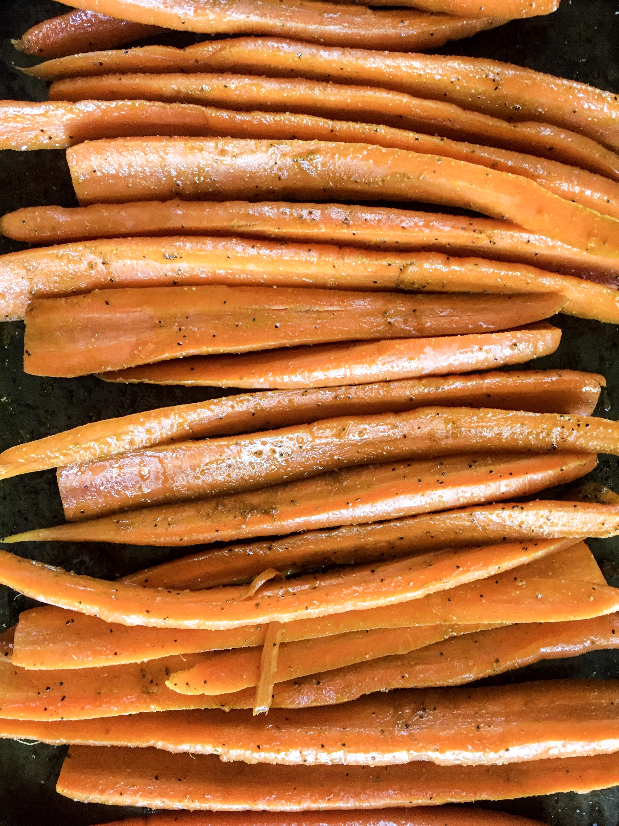 carrots tossed with olive oil and rubbed with powdered ginger and curry powder.