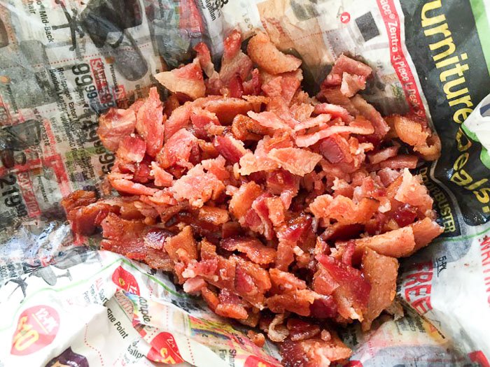 crumbled bacon in newspaper.