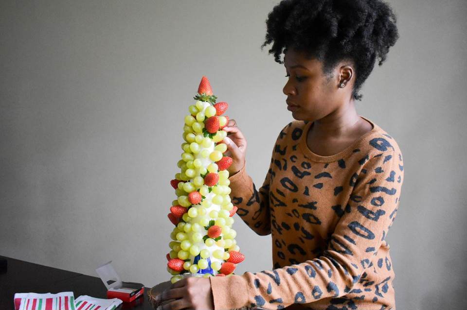 Dash of Jazz assembling a festive fruit centerpiece