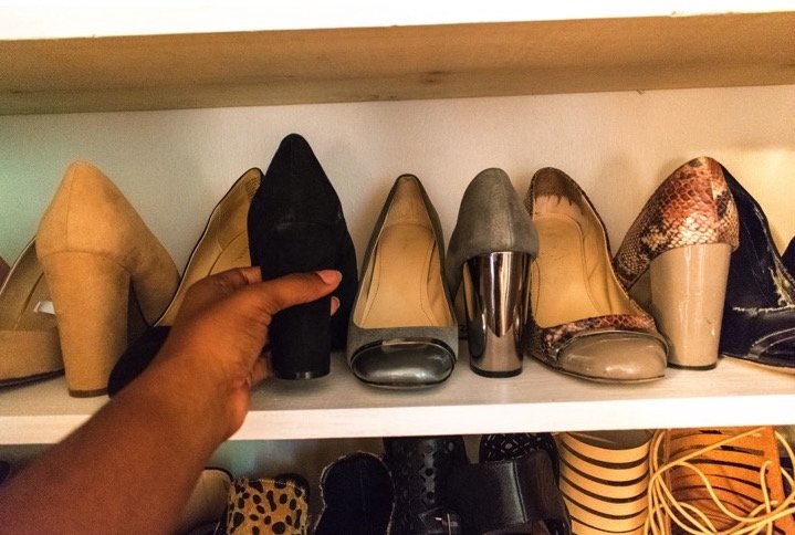 picking shoes out of shoe closet