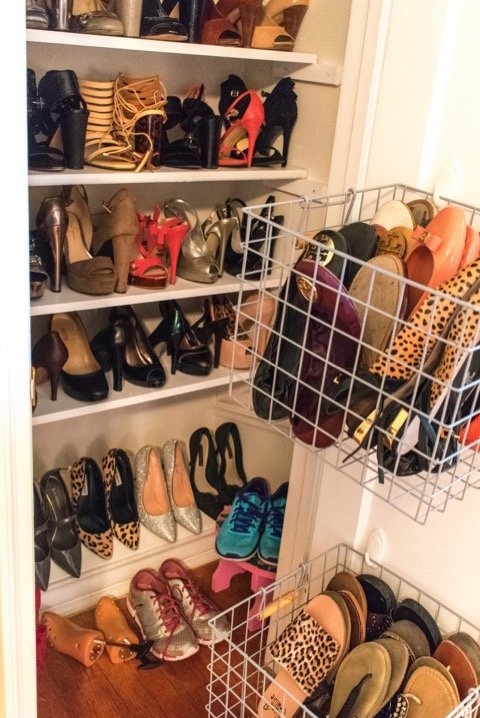 shelves and baskets of shoes in closet