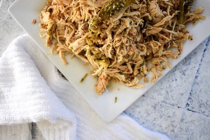 Slow Cooker Spicy Shredded Chicken perfect for adding to casseroles, tacos, and more made easily in a crock pot. Recipe by Dash of Jazz
