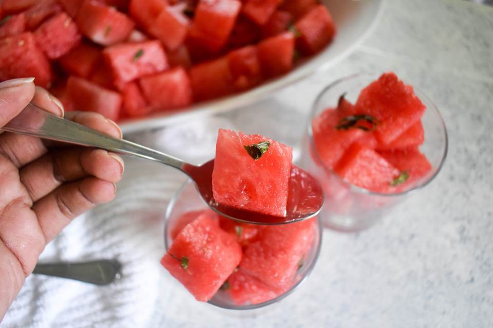eating margarita-soaked watermelon with a spoon