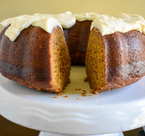 An unbelievably moist and dense pumpkin apple spice cake with Maple Cream Cheese Frosting made from scratch and perfect for the fall and holiday seasons. Recipe by Dash of Jazz