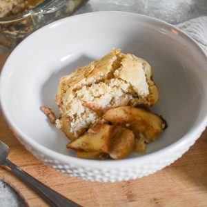 Simple Spiced Pear Cobbler is made with an easy scratch filling of crunchy pears and warm spices, and lightly sweet bisquick biscuit topping. Perfect for Fall and Winter when pears are in season! Recipe by Dash of Jazz