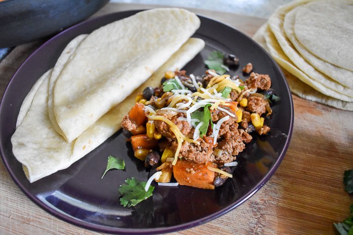 Spicy Chipotle Skillet Meal comes together in under an hour in one pan and is full of flavor and good for your ingredients. Serve it over rice, wrap it up in a tortilla or eat it as is! Recipe by Dash of Jazz