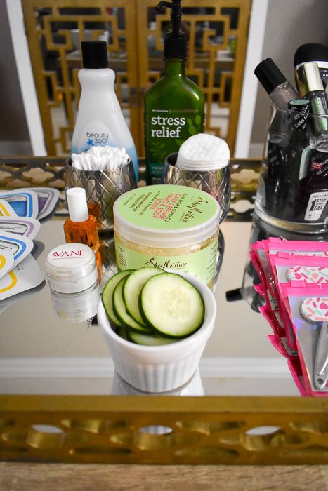 scrubs, cotton swabs, cucumber slices, and other tools for at-home spa party