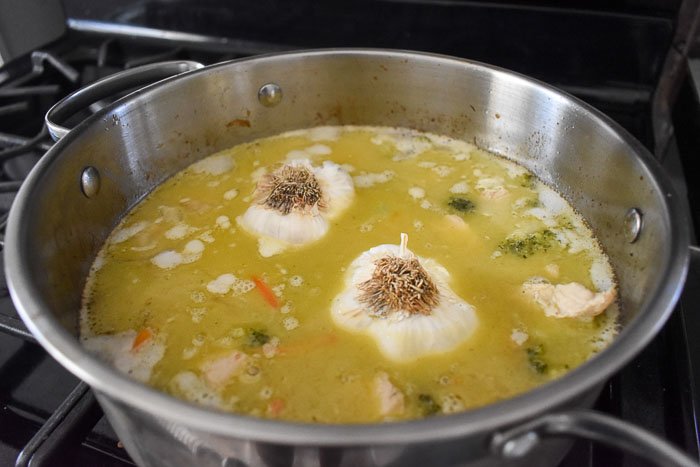 chicken, rice, and vegetables, cooking in broth