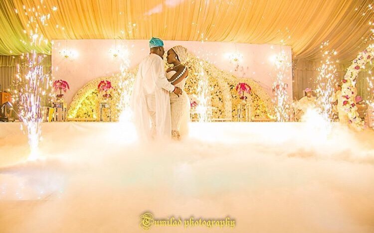 Yoruba bride and groom dancing at traditional wedding ceremony in Lagos, Nigeria