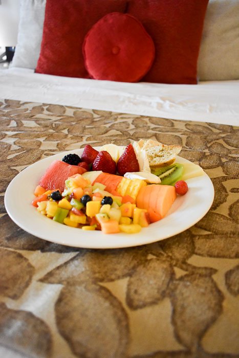 plate of fresh tropical fruits and cheses