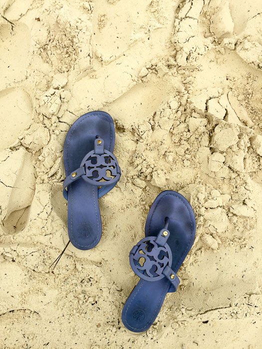 blue sandals on the beach in Cancun, Mexico