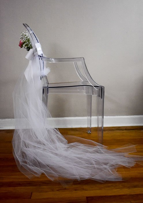 decorated bridal shower chair with white tulle train