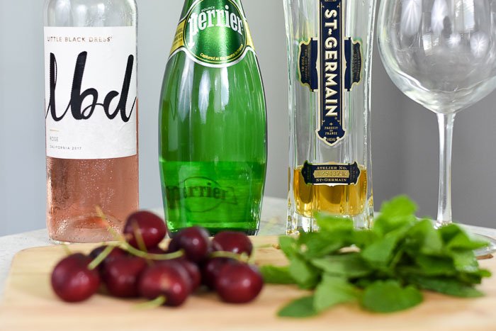 lbd rosé, perrier sparkling water, and st germain elderflower liqueur bottles