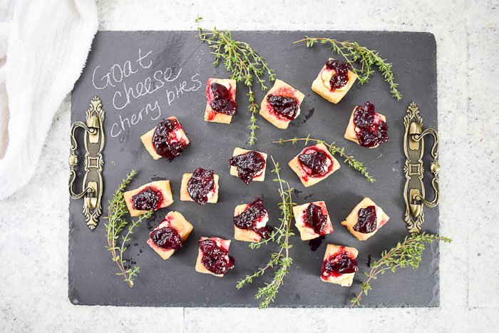 goat cheese cherry appetizer bites on slate cheese board