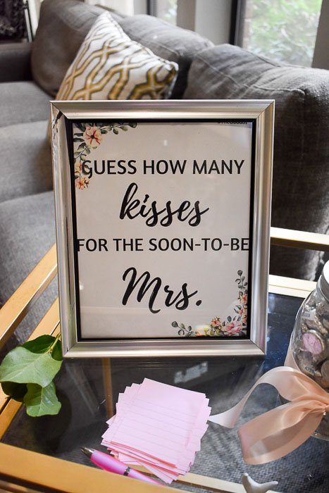 "guess how many kisses" sign for bridal shower game