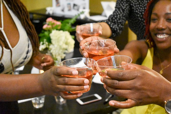 women toasting rose cocktail at bridal shower