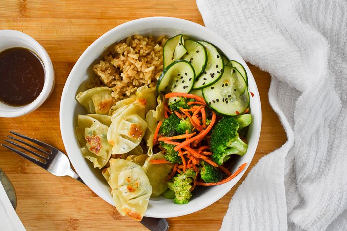 chicken wonton bowl with brown rice and vegetables.