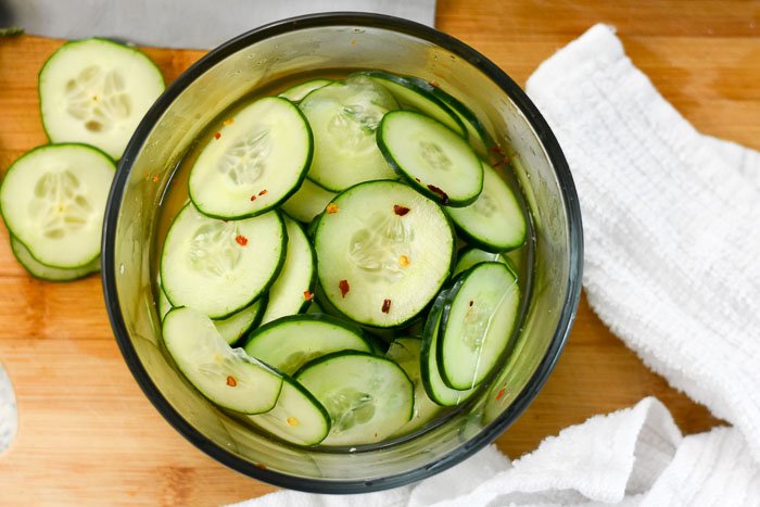 cucumber slices in quick pickle mixture.