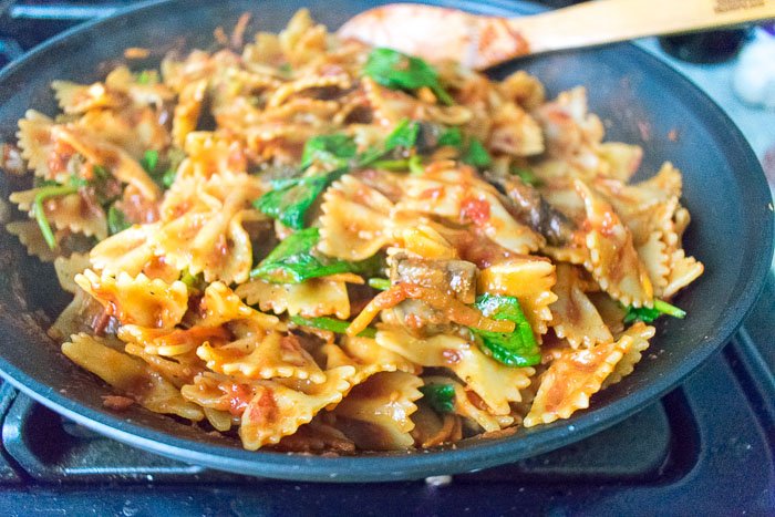 pasta skillet dinner with bowties, spinach, and sauce