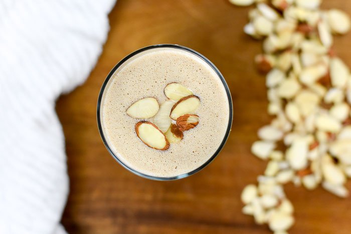 almond breakfast smoothie topped with sliced almonds