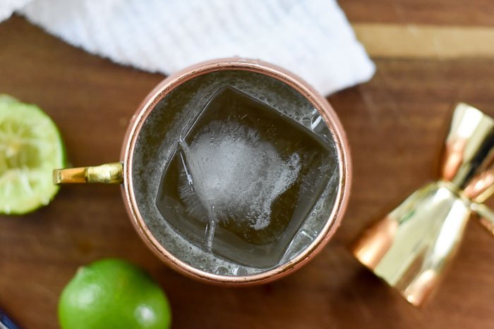 bourbon mule cocktail with giant ice cube