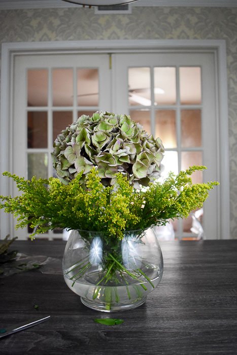 antique hydrangea and goldenrod in vase on tabletop