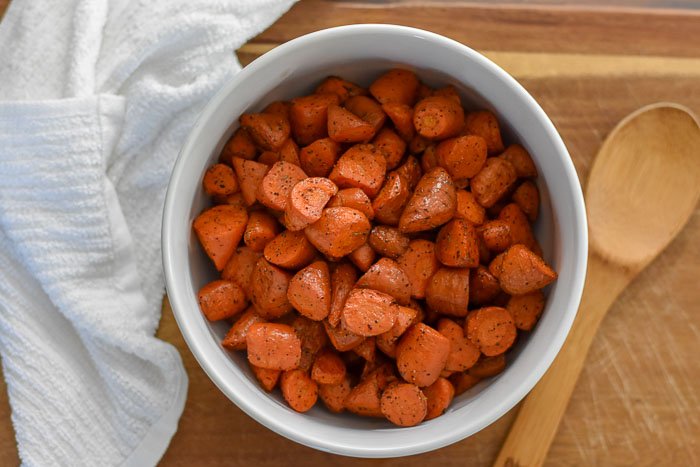 serving bowl of roasted carrots in bite size pieces.