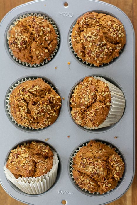 sweet potato gingerbread muffins lined with paper liners in jumbo muffin pan.