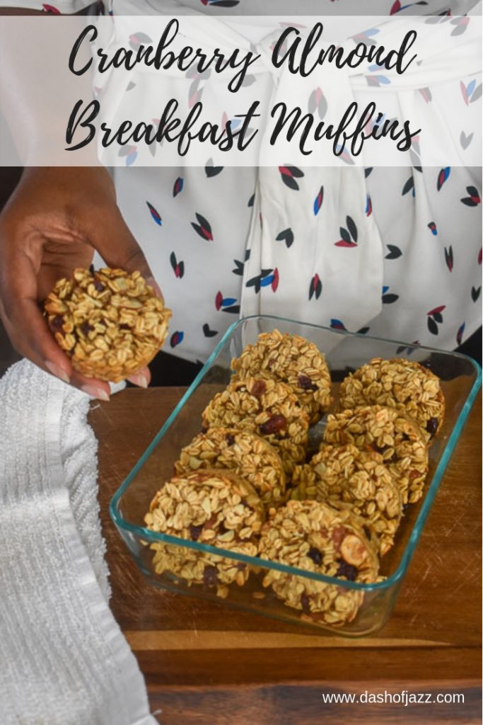 holding cranberry almond breakfast muffins