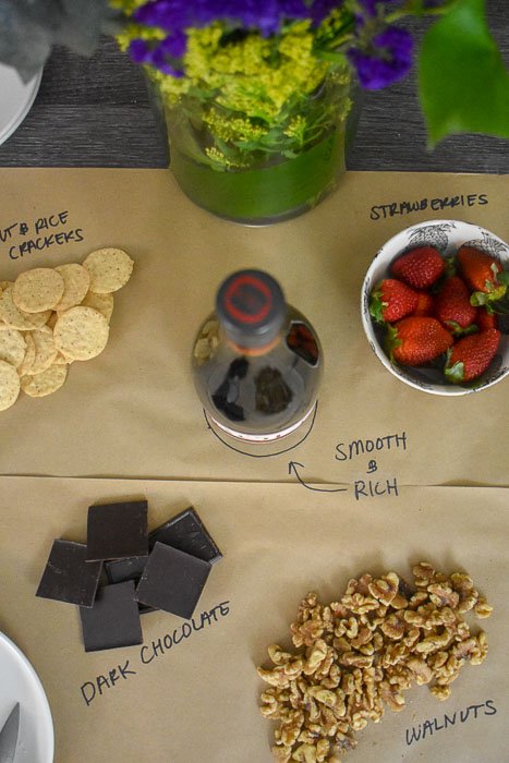 spread of wine and snacks on butcher paper