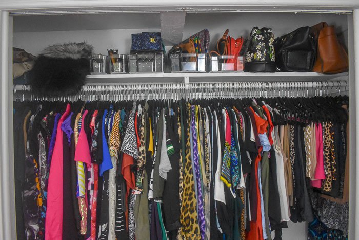 clothes and handbags organized in closet