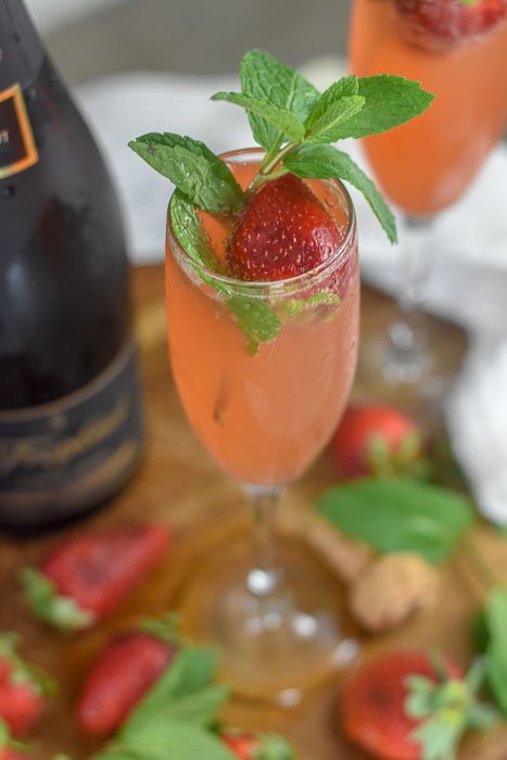 mimosa made with strawberry nectar, fresh mint, and champagne.