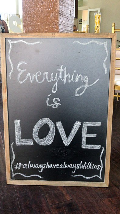 Everything is Love bridal shower welcome sign on chalkboard