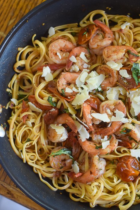 spicy shrimp tomato pasta dinner in skillet