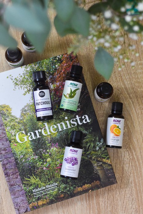 essential oil bottles and Gardenista book on coffee table