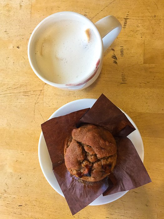 chai tea latte and peach blueberry ginger muffin at Wild Flour Cafe in Banff, Alberta
