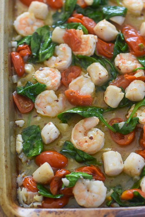 cooked shrimp & scallops on a half sheet pan