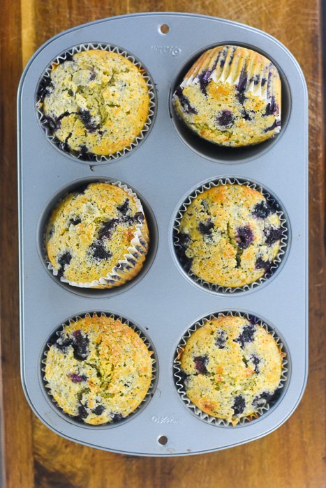 jumbo blueberry lemon poppyseed muffins in pan