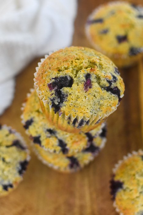 jumbo lemon blueberry poppyseed muffins on cutting board
