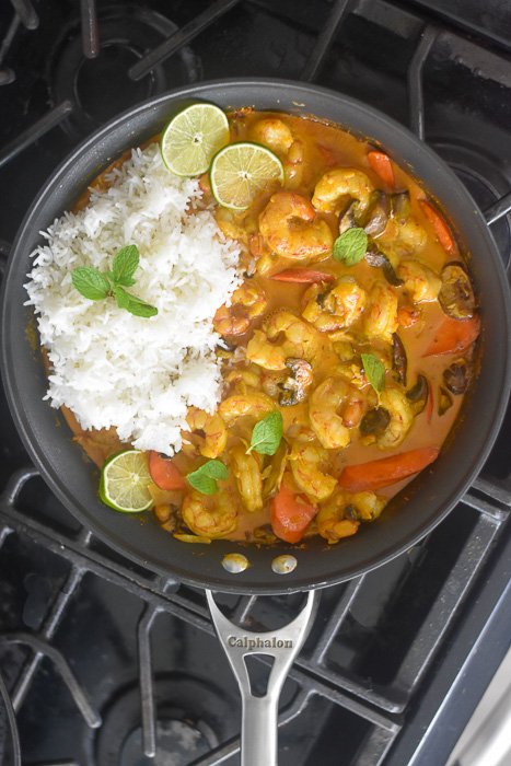 pan of coconut curry shrimp & veggies with rice