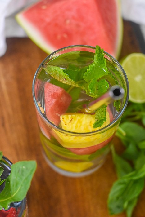 glass of water infused with fresh mint, watermelon, and pineapple