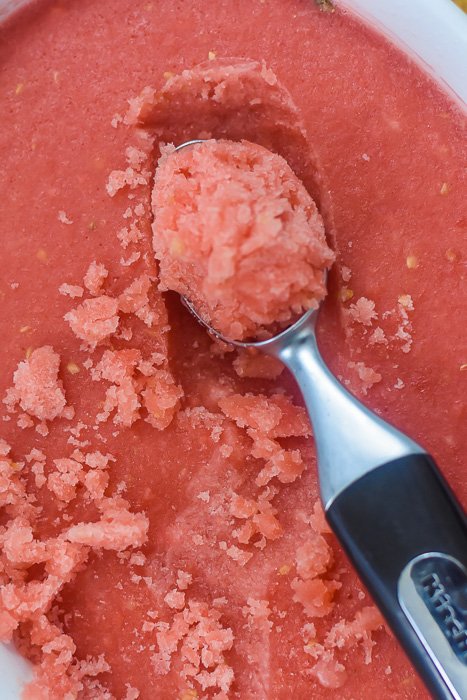 pan of watermelon rosé sorbet with ice cream scoop