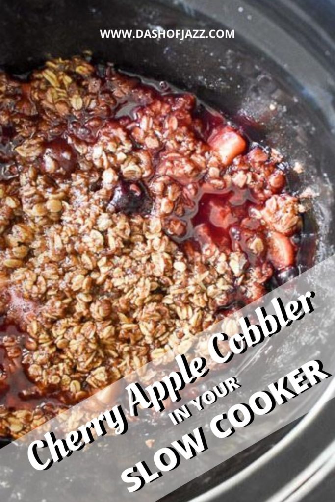 close up of cherry apple crisp in slow cooker with text overlay