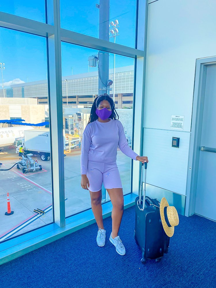 Jazzmine wearing purple co-ord set at airport