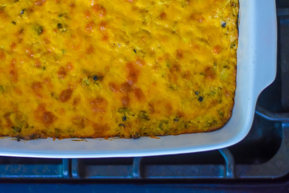 close up view of baked cheesy brussels sprouts rice casserole