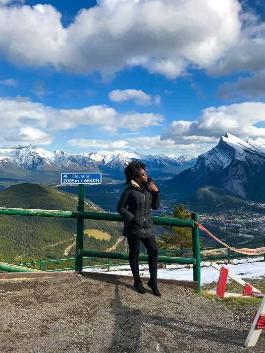 Jazzmine standing at lookout point on Mount Norquay