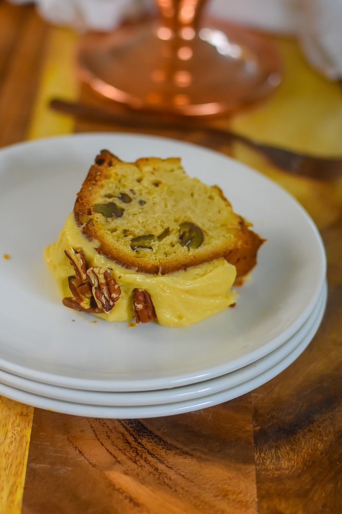 slice of pecan pound cake with praline frosting