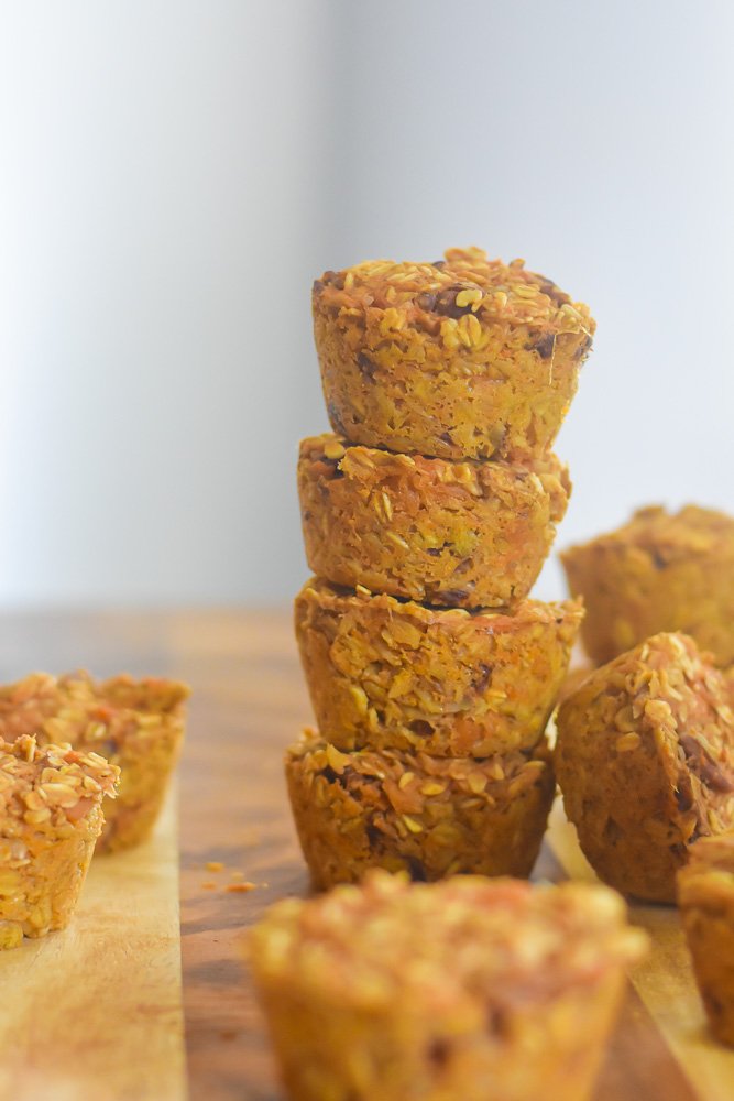 stack of sweet potato baked oatmeal muffins on cutting board