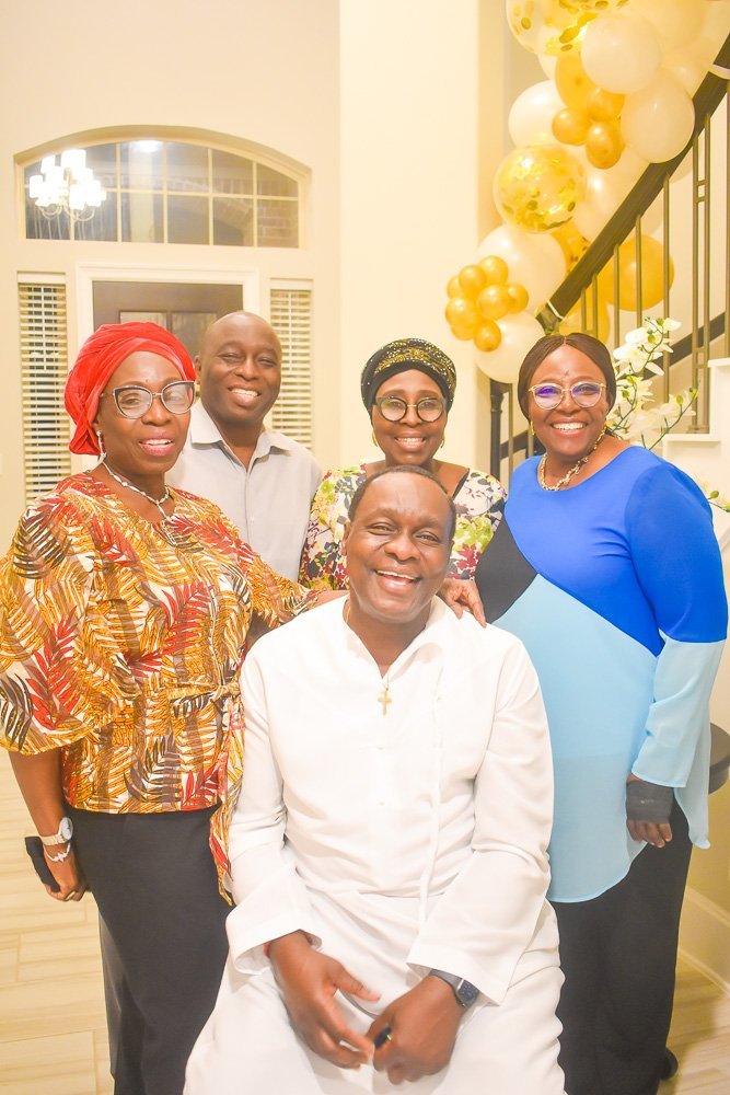 60th birthday celebrant laughing with sibling