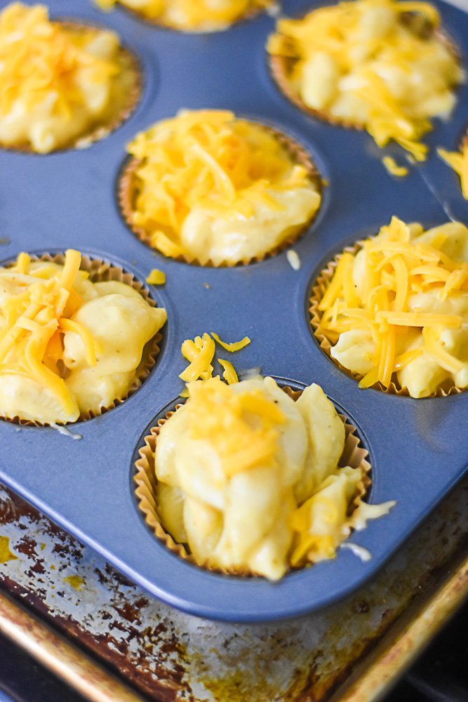 prepared mac and cheese mixture in muffin cups